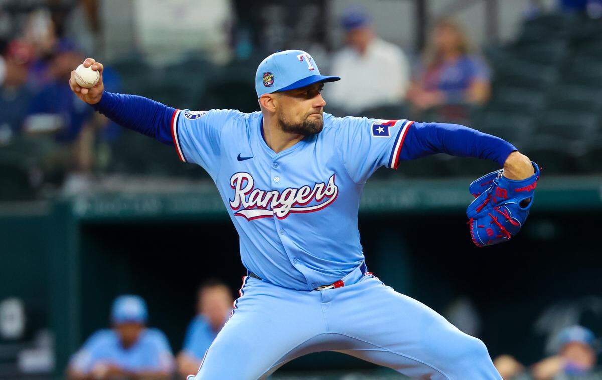 Texas Rangers pitcher Nathan Eovaldi (17) throws during the first inning against the San Francisco Giants at Globe Life Field.