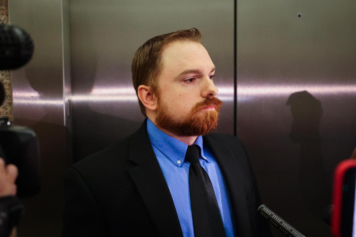 Former Fort Worth police officer Aaron Dean waits by the elevators after a hearing in his case on Tuesday, Nov. 16, 2021. He is charged with murder in the October 2019 shooting of Atatiana Jefferson.