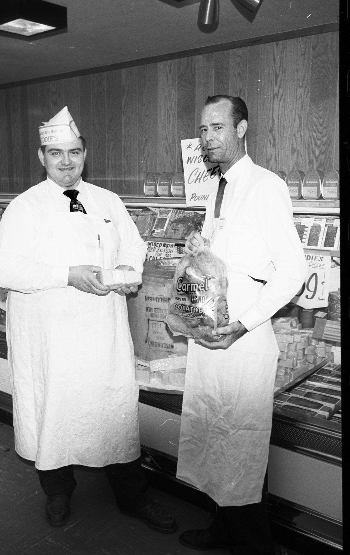 April 2, 1959: J.C. Williams, meat market manager, and Early Denman, a produce man, stock the self-service counters in a new Buddies Super Market at 6528 Meadowbrook Drive. (The location was near where Church’s Chicken is today.)