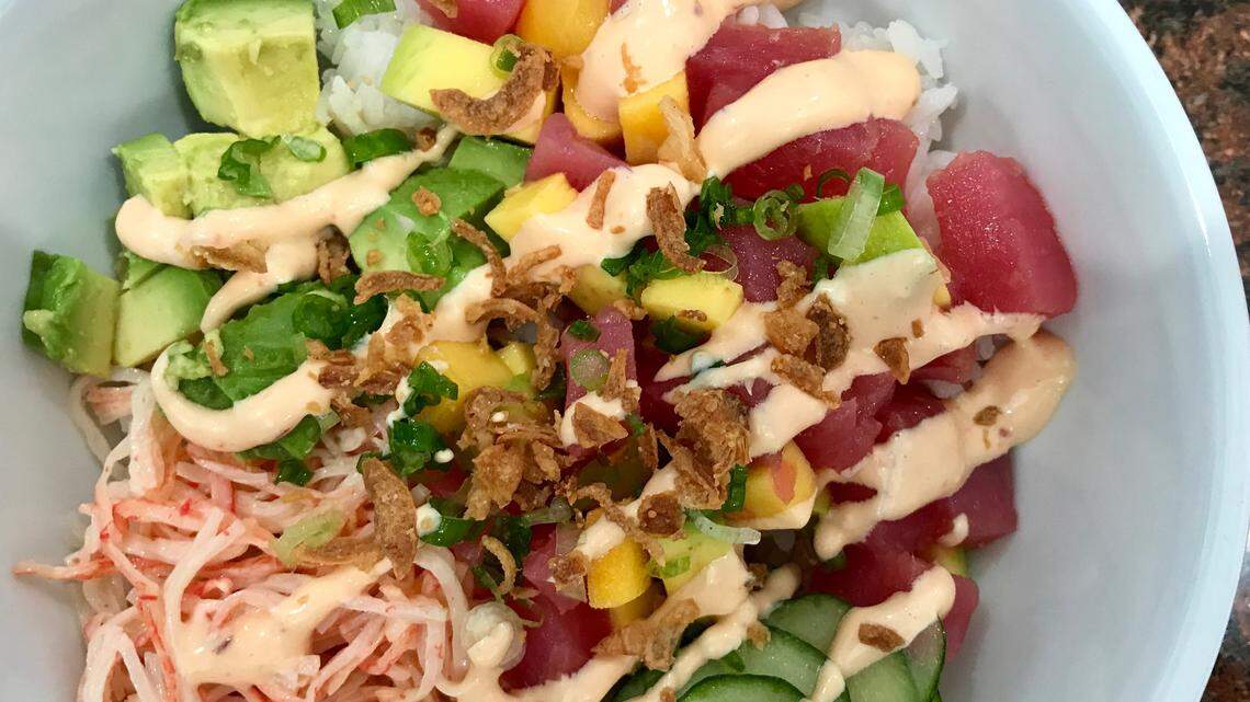 Fort Worth's Poke Stop offers a build-your-own option, and this bowl didn't disappoint. It has white sushi rice with ahi tuna, avocado, crab mix, mango, cucumber and spicy mayo, plus crispy onions