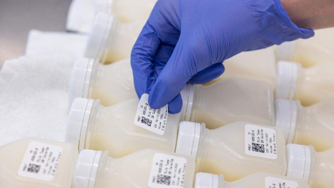 Bottles of pasteurized breast milk are labeled with nutritional data and expiration dates at the Mothers’ Milk Bank of North Texas. The milk is pasteurized at 144.5 degrees Fahrenheit for 30 minutes and poured into BPA-free bottles with tamper-resistant lids.
