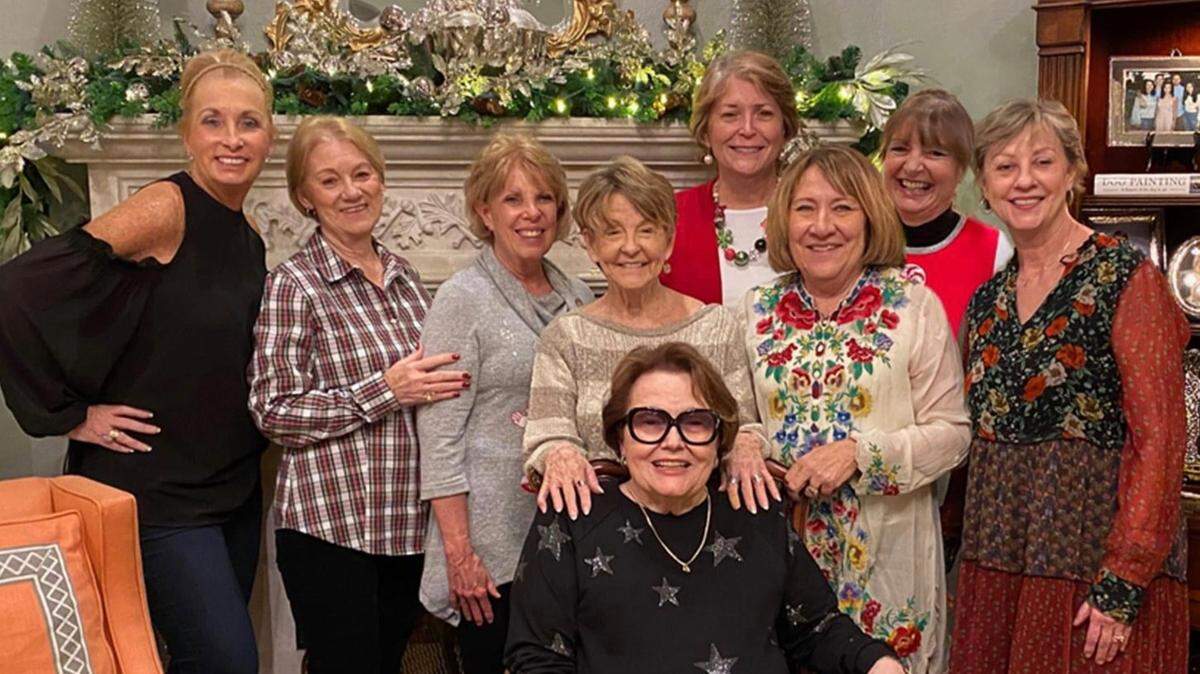 From left, Kathy Farley, Judy Green, Debbie Martin, Claudia Radford, Carolyn Phelps, Julie McGuffee, Sherri Steele and Joyce Early (front) make up the group Soul Sisters. They share a common bond of having spouses with dementia. They support each other through weekly dinners and sharing their experiences.