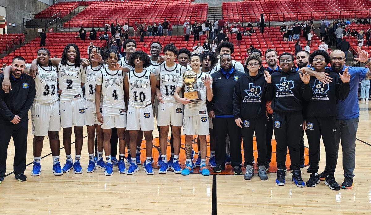 The Mansfield Summit boys basketball team poses with the trophy after defeating Colleyville Heritage in the Class 5A Division 2 Region I Final on Friday, February 28, 2025 at Wilkerson-Greines Activity Center in Fort Worth, Texas.