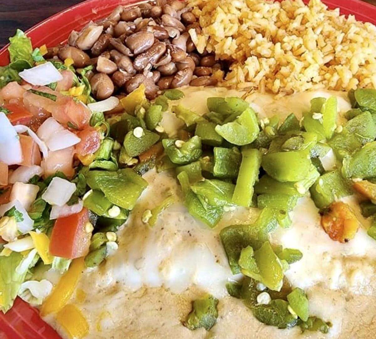 Enchiladas with extra Hatch green chiles at Enchiladas Olé in Fort Worth.