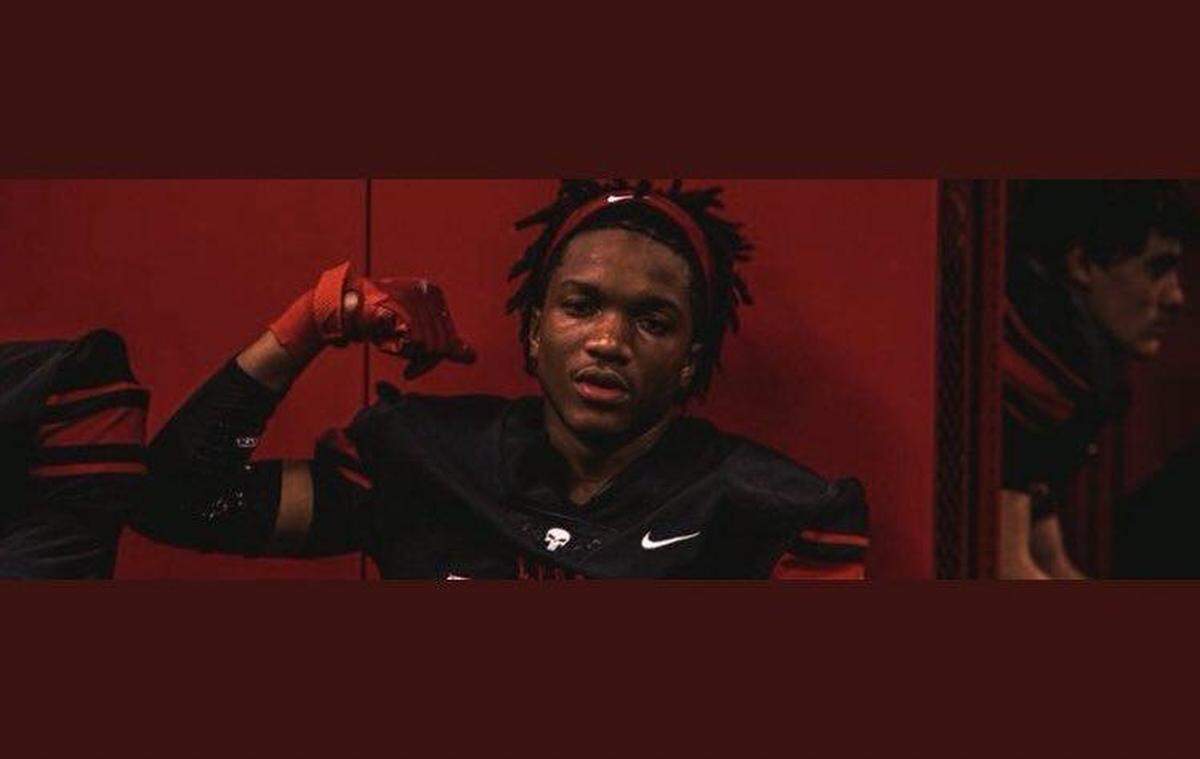 Tre Allison poses for a photo in his football uniform, flexing his right arm. After he was killed in a hit-and-run car crash on Monday night, the Burleson community has come together to remember him for the player he was on the field and the person he was off of it.
