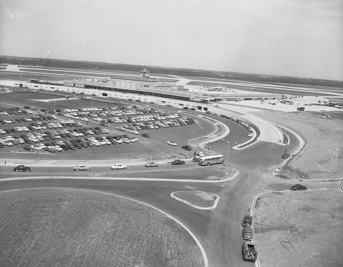 April 25, 1953: An aerial view of cars driving into parking areas at the new Greater Fort Worth International Airport before an opening ceremony.