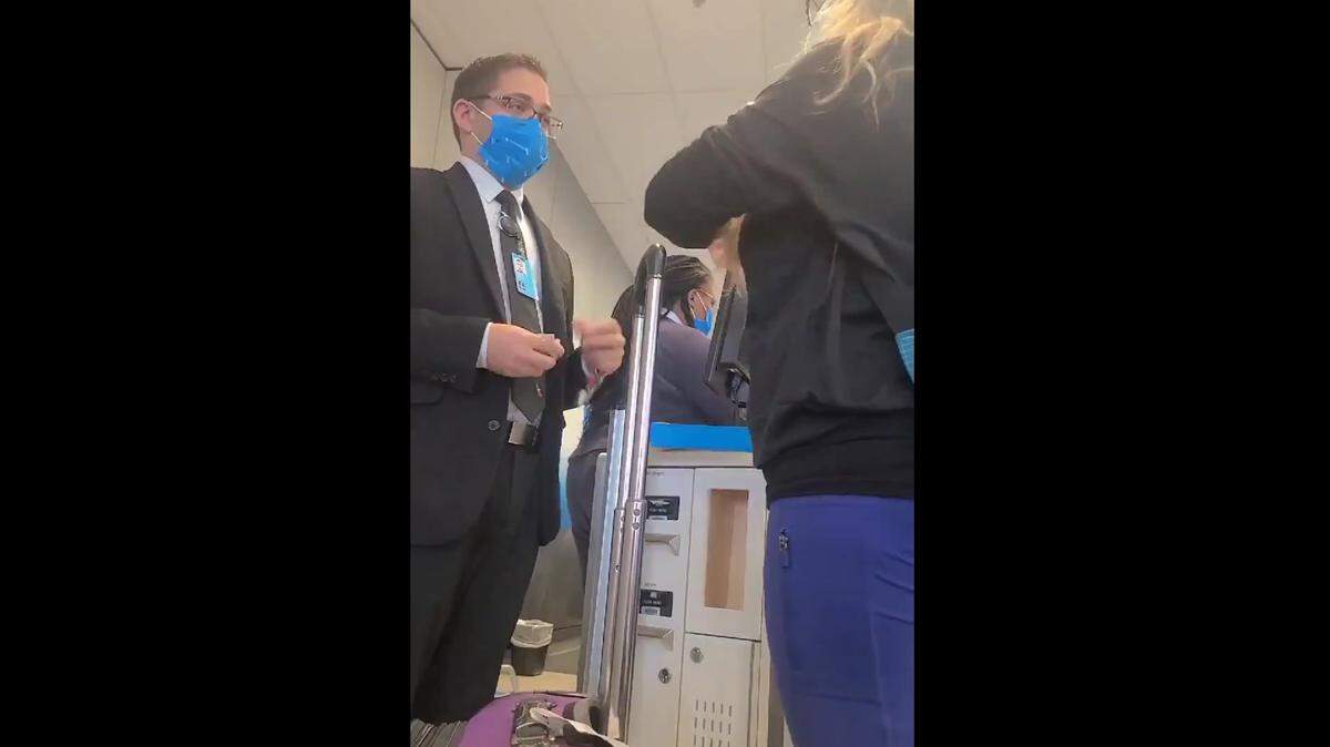 The unnamed American Airlines agent kept his cool while speaking to the passenger, video shows.