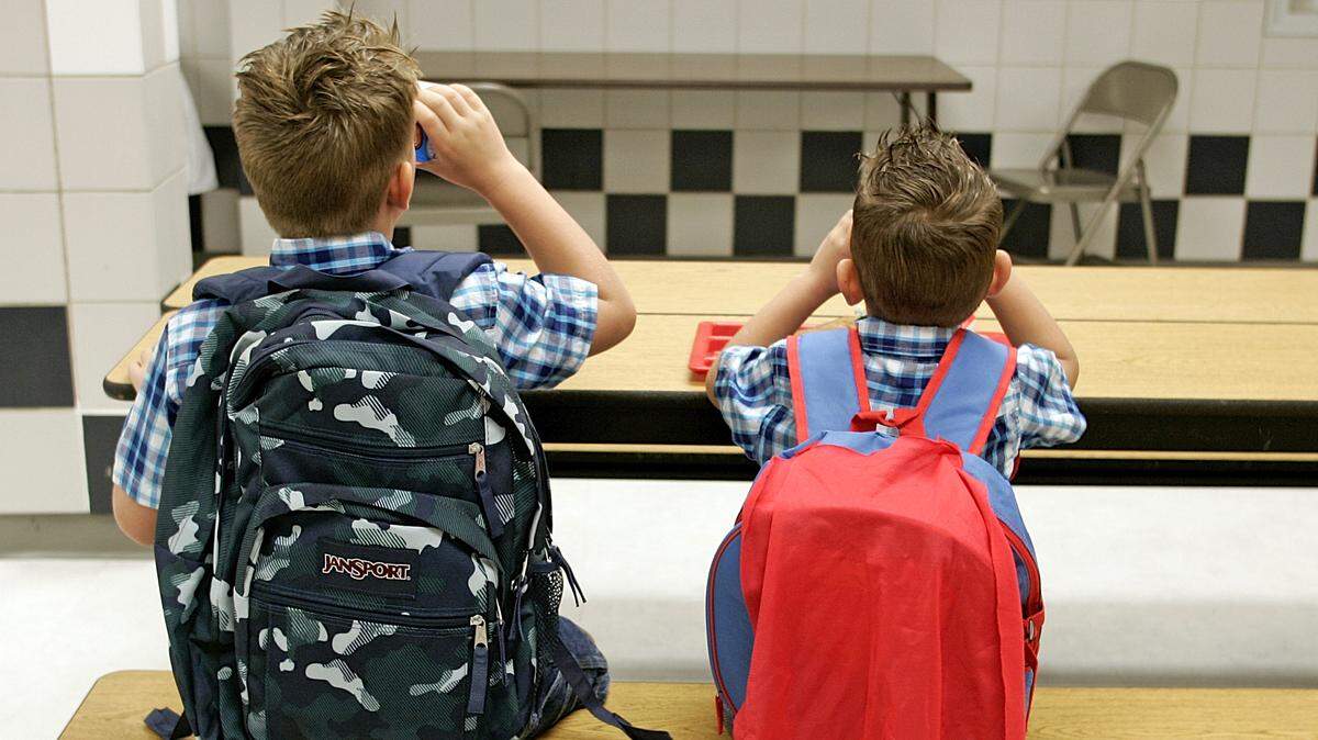 Two brothers enjoy breakfast before the first day of school at Dove Elementary School in Grapevine on Aug. 25, 2014.
