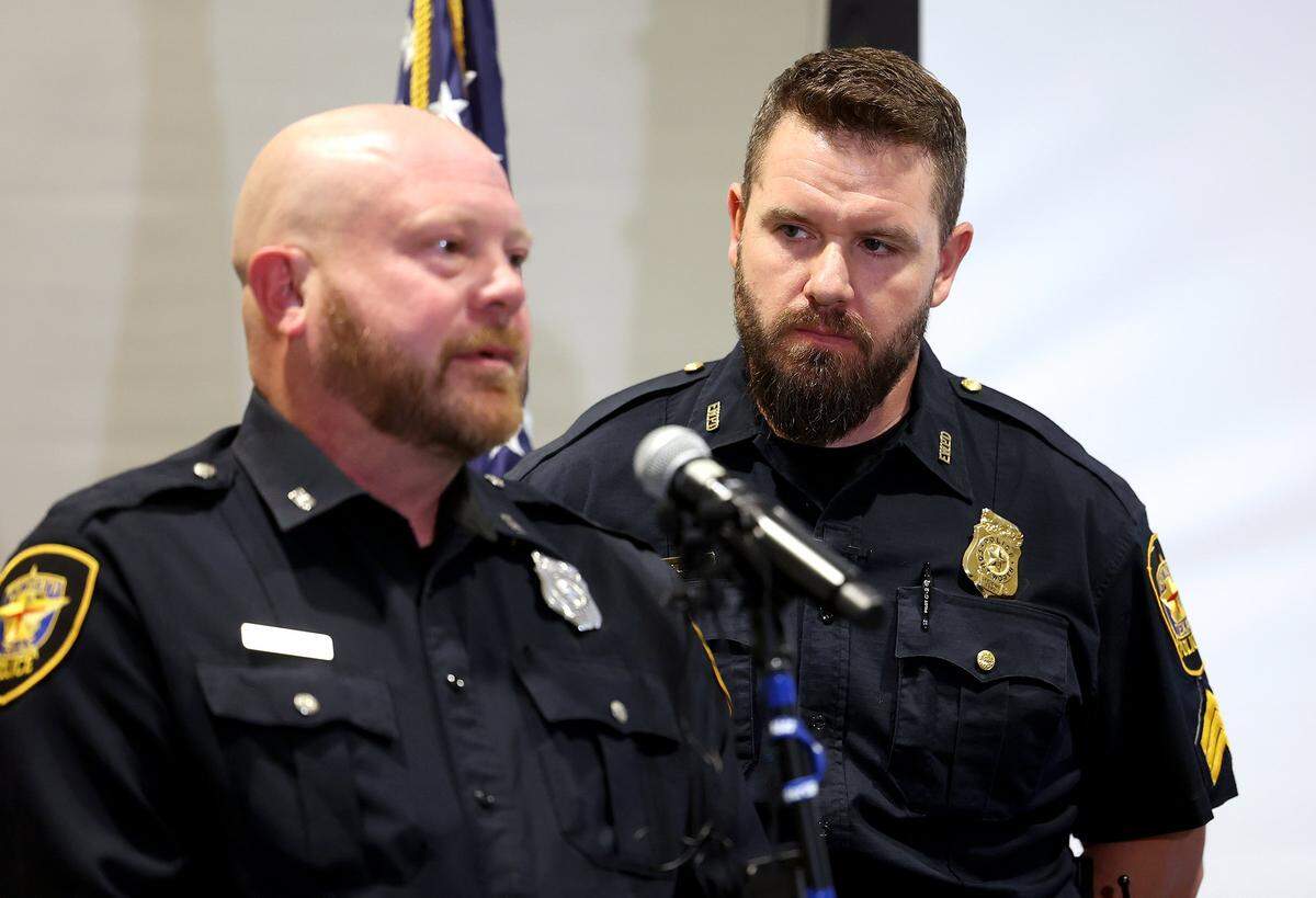 Fort Worth Police Officer Edwin Bounds, left, and Sgt. Ryan Nichols talk about their experience of saving a one-year-old child trapped under an overturned vehicle 1-year-that crashed on Interstate 30 during a press conference on Tuesday, Oct. 28, 2025.