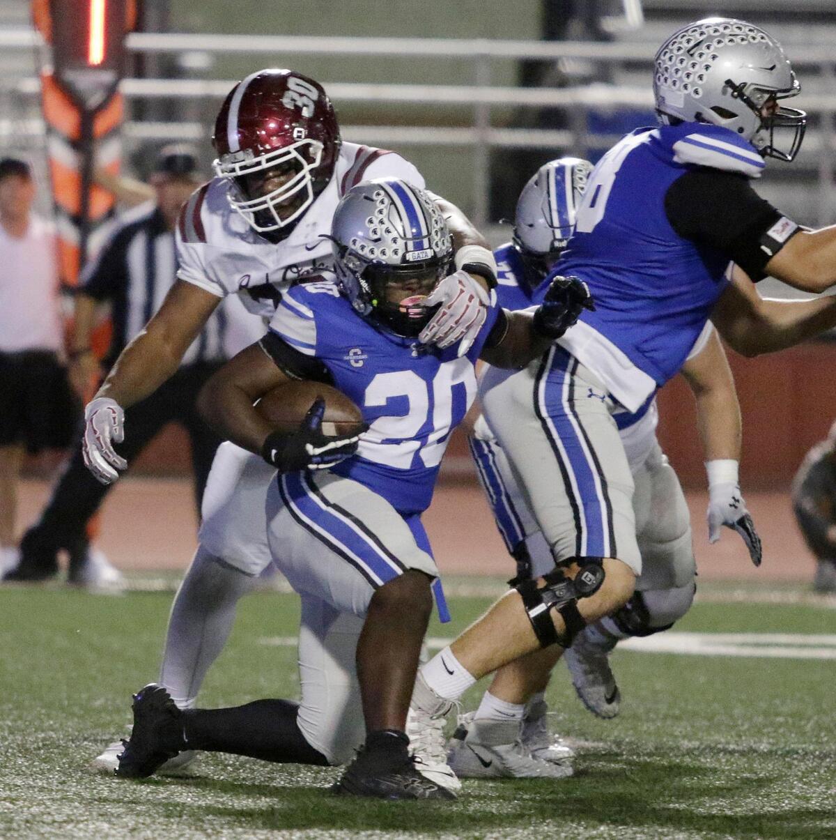 Burleson’s Jaylon Walker is brought down in the backfield during a UIL football game at Burleson ISD Stadium on Friday , October 25, 2024.
