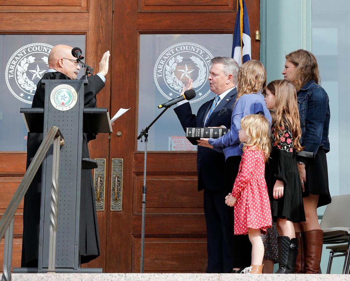 Tim O’Hare is sworn in with his family next to him as Tarrant County judge on the steps of the courthouse in Fort Worth. (Special to the Star-Telegram Bob Booth)