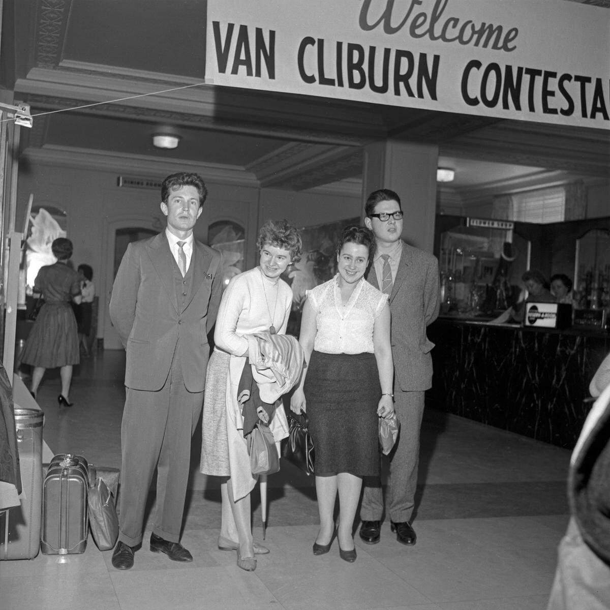 For the first Cliburn competition in 1962, Soviet entries in the Van Cliburn International Piano Competition pose beneath the welcome sign at Hotel Texas upon arrival from Moscow. From left: Mikhail Voskresenski, Ilze Graubin, Nina Lelchuk and Nikolai Petrov.