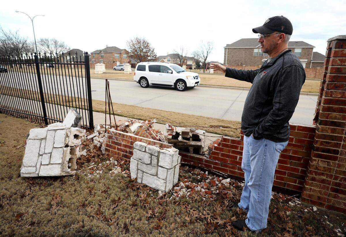 Keith Rakovan shows debris from a brick wall separating his house from Park Vista Boulevard that was destroyed when a car crashed into it in December of 2021. Rakovan says it was the fourth time it’s happened since he moved in 15 years ago.