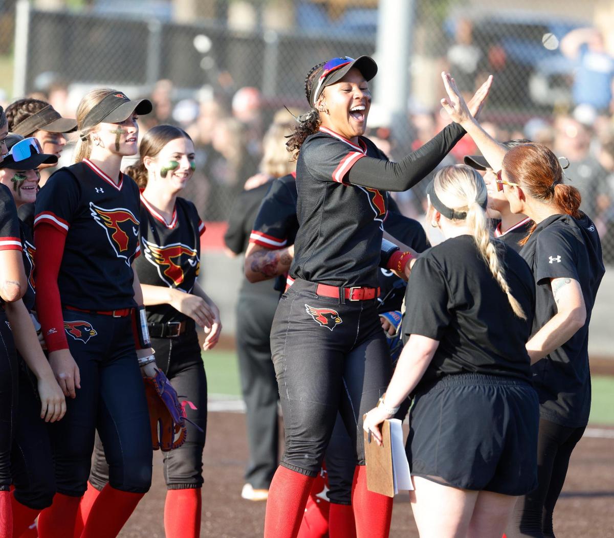 Melissa center fielder Finlee Williams (2) celebrates her home run with team mates during the UIL softball state semifinals 5A D1 playoff game at Trojan Softball Field in Euless, Texas, Wednesday, May 21, 2025.