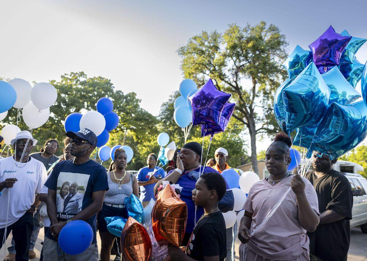 Family and friends of Dominique Coleman remember him during a vigil on Tuesday, May 12, 2026 in Fort Worth, Texas. Coleman, who was working as a security guard at Club New Start on Miller Avenue, was shot and killed early Sunday during an argument with customers outside the club.