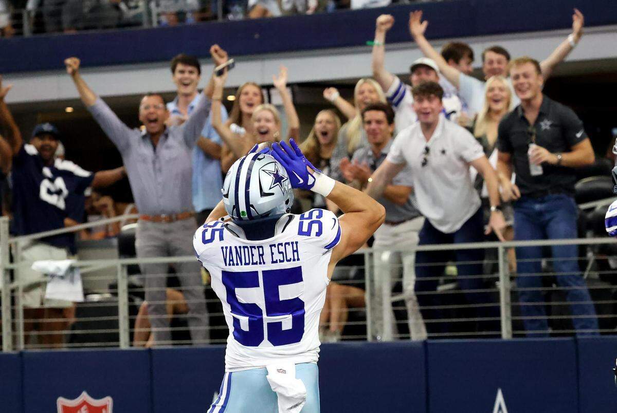 Dallas Cowboys linebacker Leighton Sander Esch celebrates with a howl to fans after scoring a defensive touchdown against the New England Patriots on Sunday, October 1, 2023, at AT&T Stadium in Arlington.