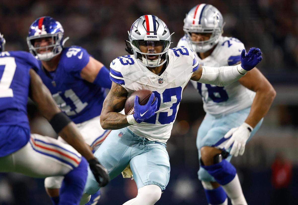 Dallas Cowboys running back Rico Dowdle runs the ball during the second quarter against the New York Giants on Sunday, November 12, 2023, at AT&T Stadium in Arlington.