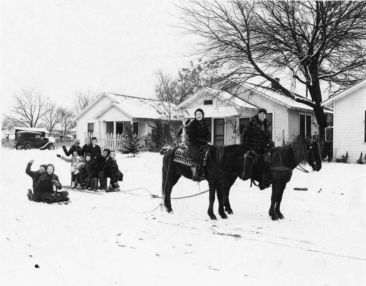 Jan. 24, 1948: “Adults on horseback and children on sleds playing in snow, names not identified, Fort Worth.”