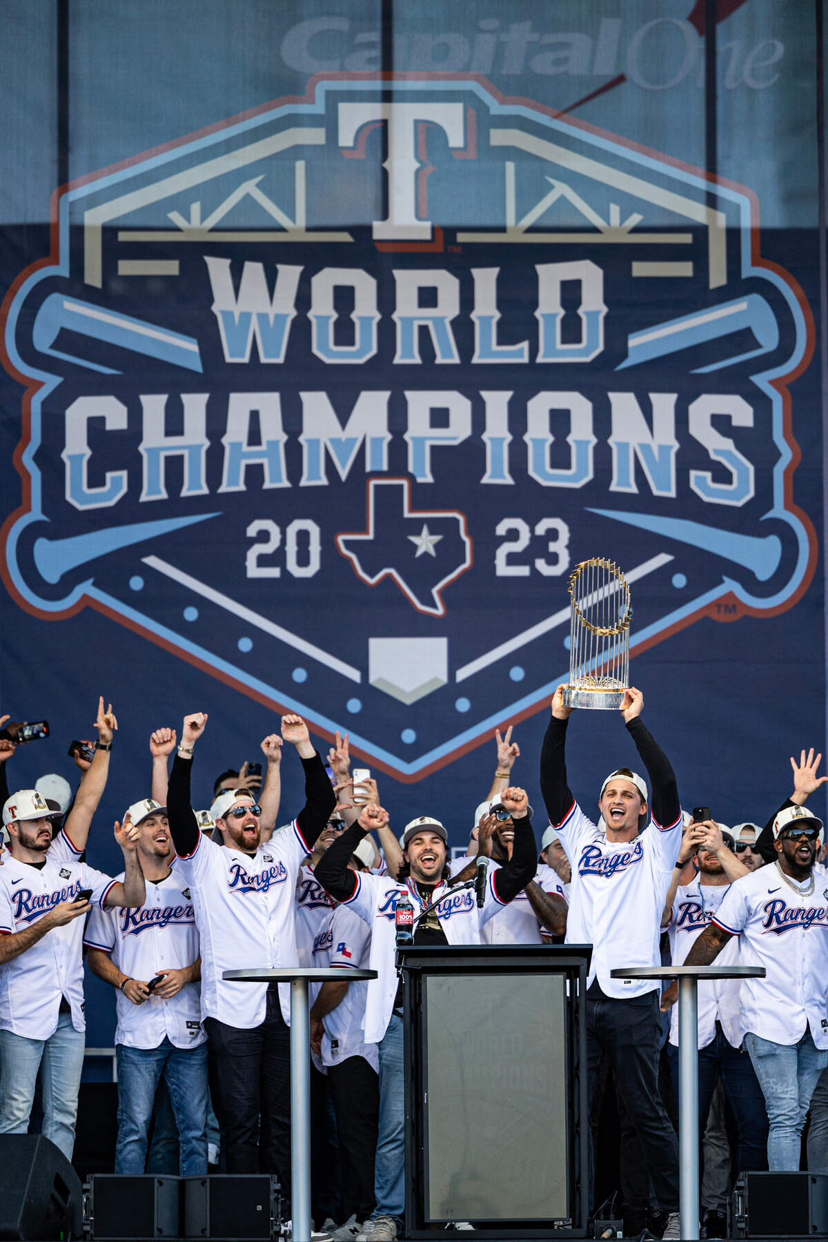 Rangers shortstop Corey Seager holds up the World Series Trophy during their Championship Ceremony at the Texas Live! Plaza in Arlington on Friday, Nov. 3, 2023.