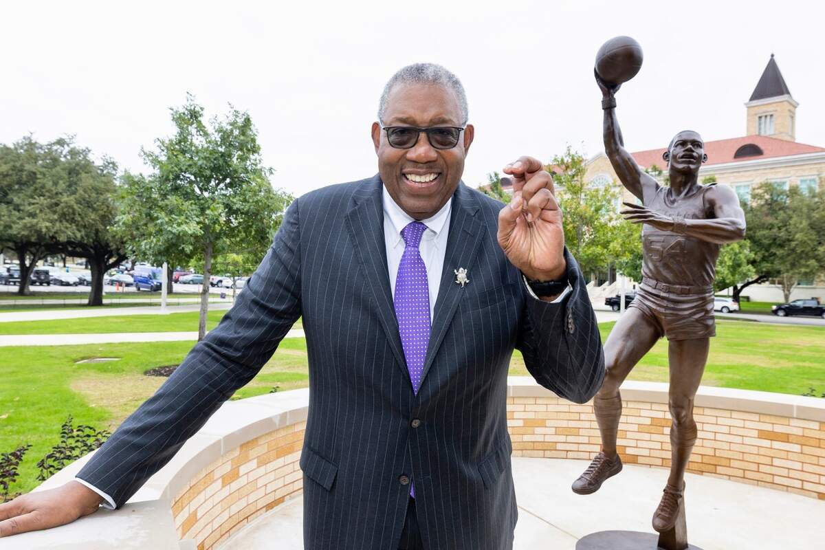 TCU basketball star and former Harvard Business School leader Dr. James Cash with his statue unveiled Friday, Nov. 11, 2022.