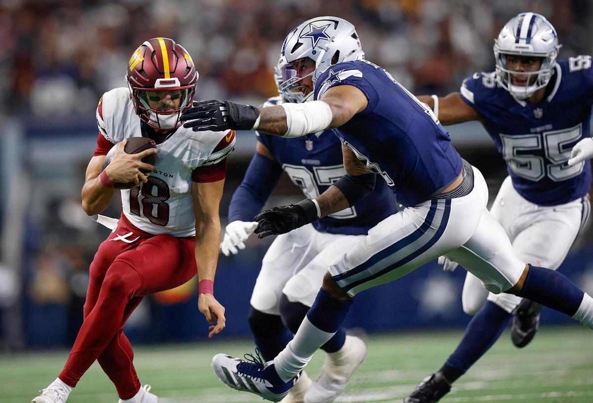 Dallas Cowboys defensive end Micah Parsons attempts to sack Washington Commanders quarterback Marcus Mariota on Sunday, Jan. 5, 2025, at AT&T Stadium in Arlington.
