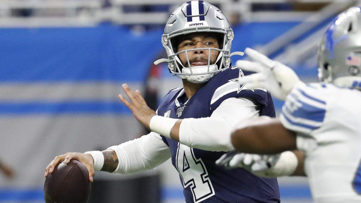 Dallas Cowboys quarterback Dak Prescott, pressured during the first half, finished with 444 yards passing and three touchdowns in Sunday’s 35-27 victory over the Detroit Lions.