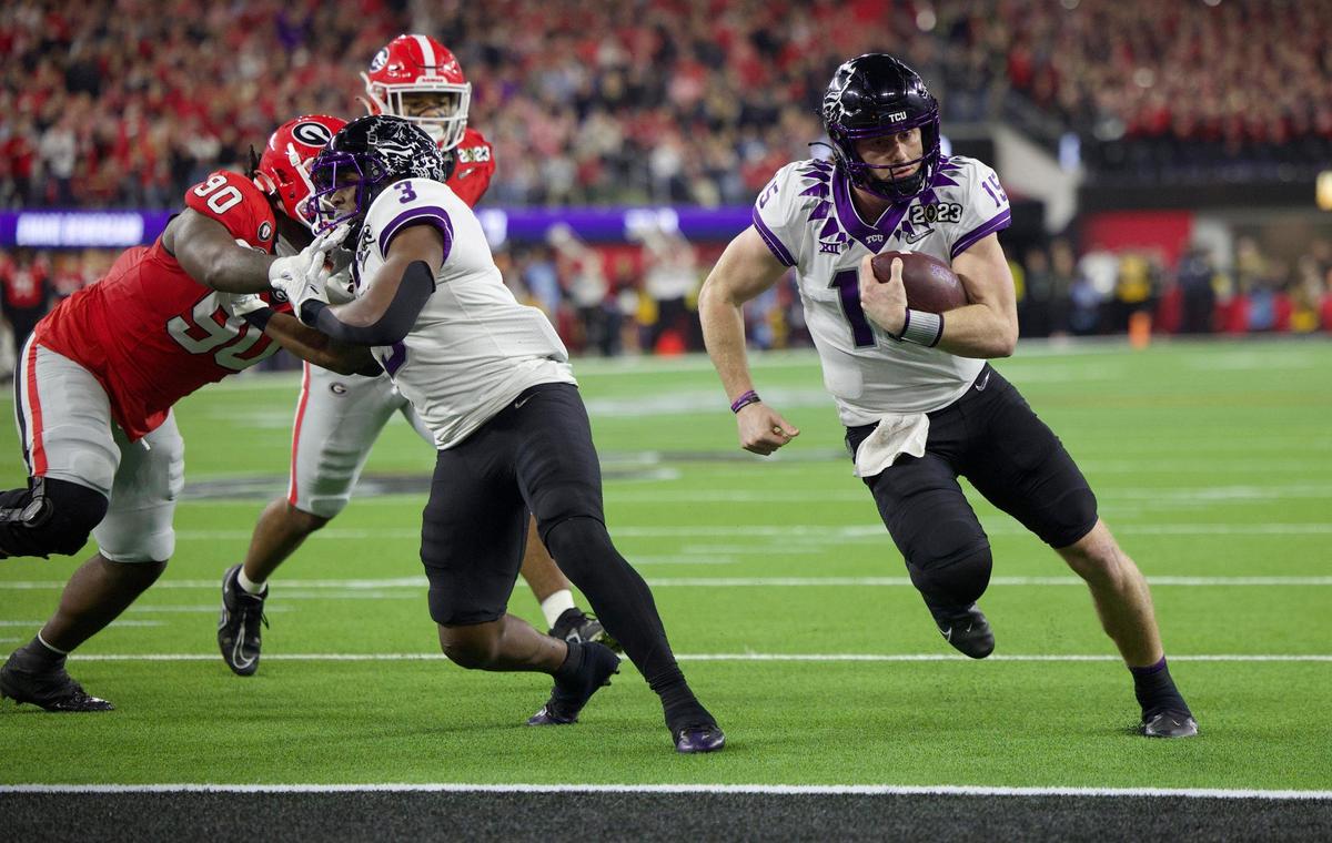 TCU Horned Frogs quarterback Max Duggan makes a short run for a touchdown in the first quarter against Georgia during the College Football Playoff National Championship on Monday, Jan. 9, 2023, at SoFi Stadium in Inglewood, Calif.