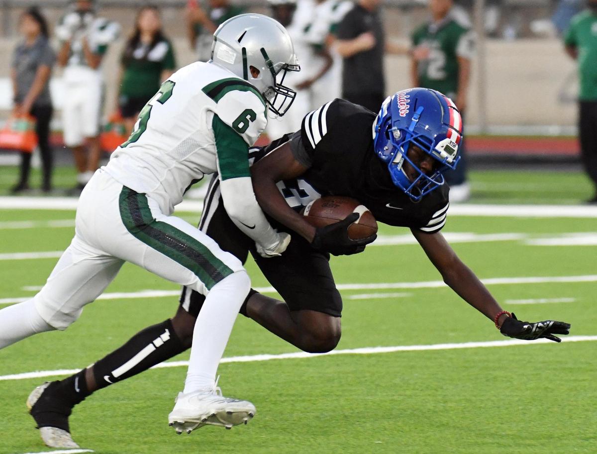 Trimble Tech’s Nick Martinez, left tackles Southwest’s Jaylyn Ferguson as he makes a catch for a first down in the first quarter of Thursday’s September 29, 2022 District 4-5A Division 2 football game at Clark Stadium in Fort Worth, Texas. Special/Bob Haynes