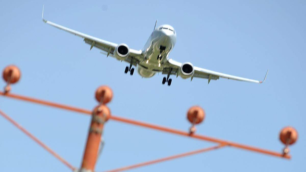 A Boeing 737 airliner landing at DFW International Airport.