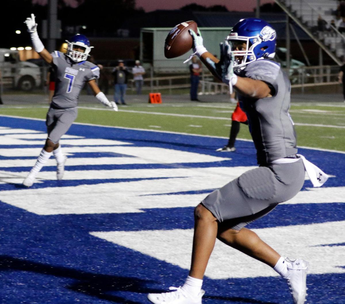 Weatherford wide receiver Melvin Polk (7) celebrates as wide receiver Isaiah King (13) grabs a pass for their first touchdown in a District 3-6A high school football game at Kangaroo Stadium in Weatherford, Texas, Friday Oct. 22, 2021. Trinity led 28-7 at the half. (Special to the Star-Telegram Bob Booth)