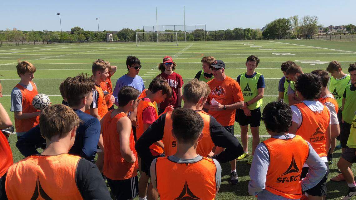 Aledo coach Derek Vierling, with cap and sunglasses, discusses Wednesday practice, April 18, 2018.