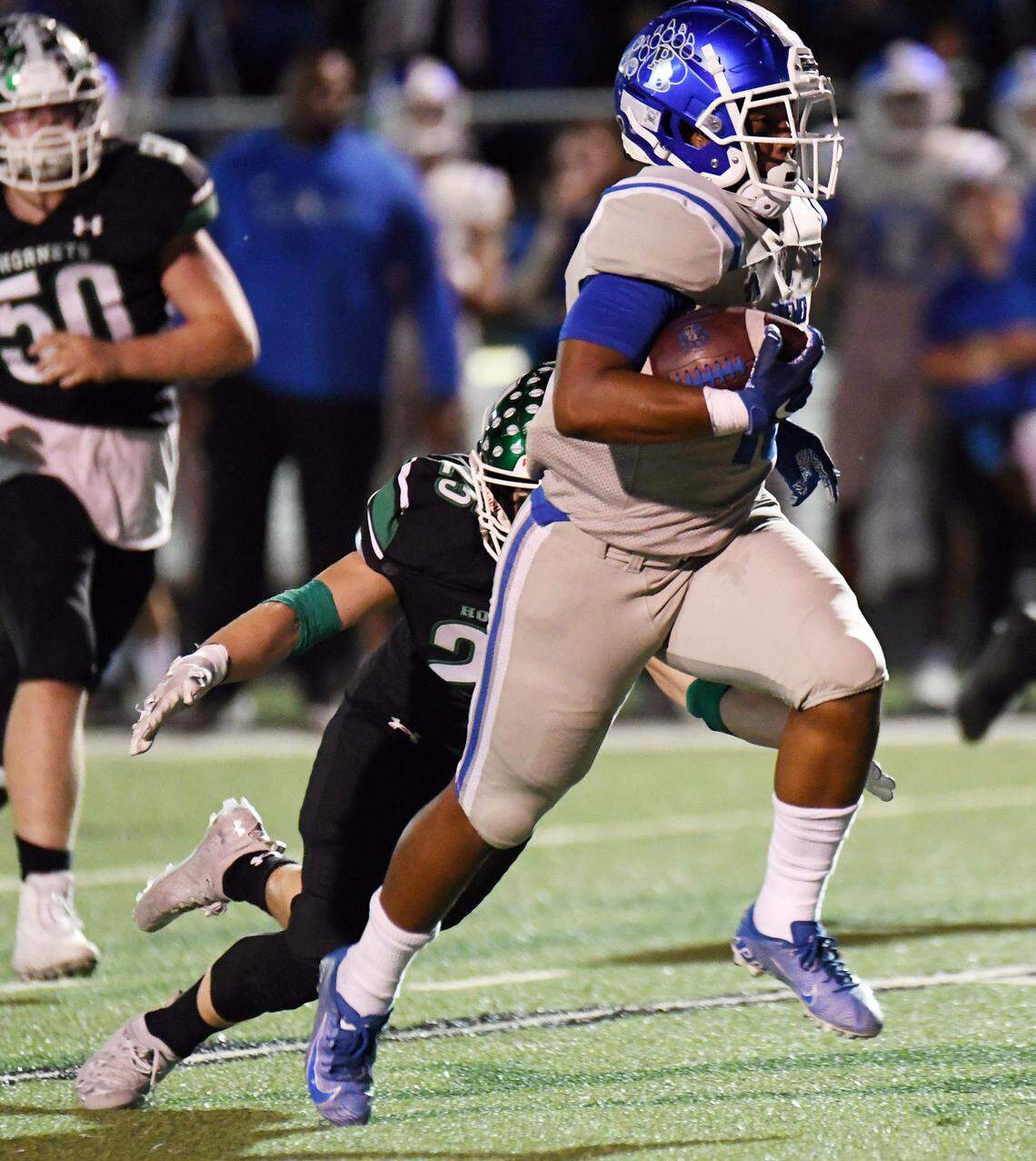 Brewer’s Montrail Cushionberry, right breaks the tackle of Azle’s Triton Towner to run 25 yards into the endzone to tie 7-7, in the first quarter of their district 3-5A Division 1 football game Friday, October 22, 2021 at Hornet Stadium in Azle, Texas. Special/Bob Haynes
