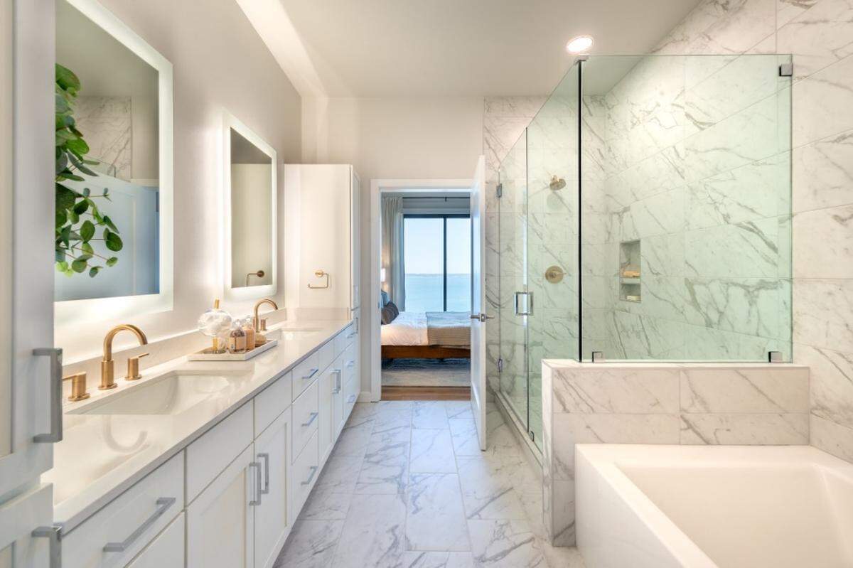 The primary bathroom in a unit at Thirty-One Eleven Sunset, a 16-story, 207-unit luxury residential apartment tower overlooking Lake Grapevine in Flower Mound.
