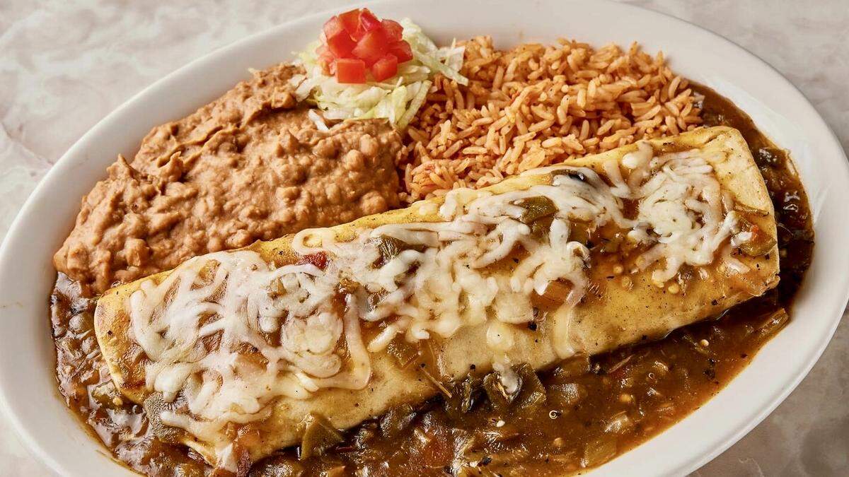 The Chuy’s “Big As Yo’ Face” burrito with Tex-Mex chili sauce.