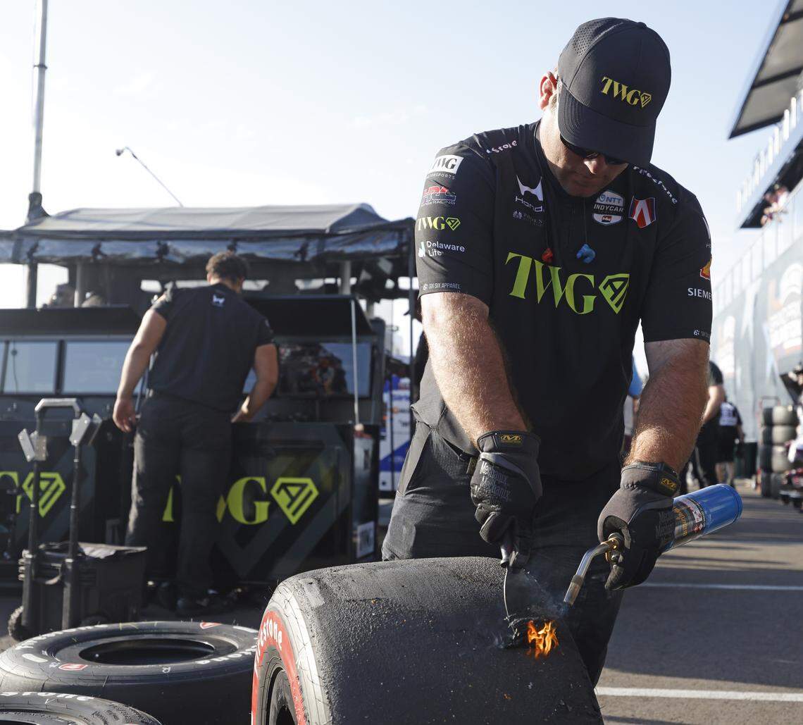 A crew member for Will Power (26) works on tires for the inaugural Java House Grand Prix of Arlington in Arlington, Texas, Sunday, March, 15, 2026.