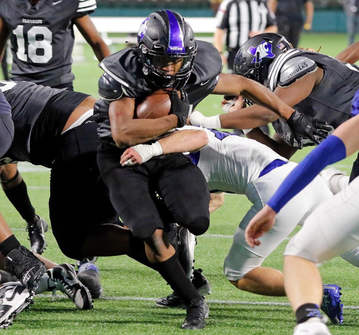 North Crowley running back Dejuan Lacy (24) takes the ball up the middle to the one yard line during a high school 6A Division 2 bi-district football playoff game at Globe Life Park in Arlington, Texas, Friday, Dec. 11, 2020. North Crowley defeated Byron Nelson 23-16. (Special to the Star-Telegram Bob Booth)