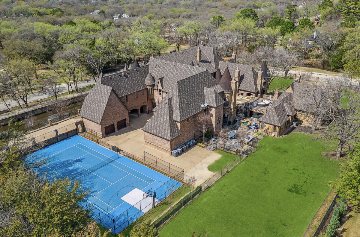 The home is flanked by a tennis court. (Provided by Briggs Freeman Sotheby’s International Realty)