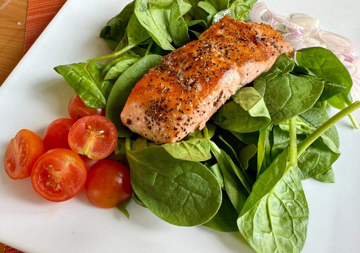 Salmon on a spinach salad from the lunch menu at Salt Seafood and Steak House in Weatherford.