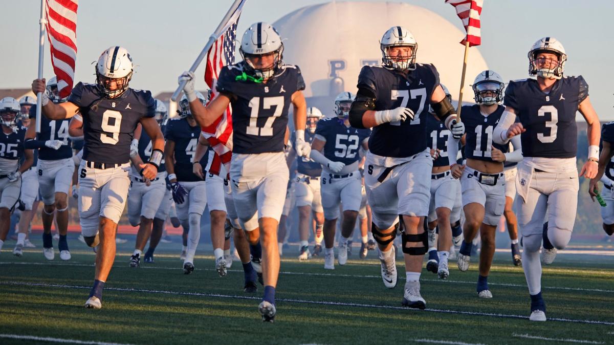 The Fort Worth All Saints Saints enter the field for a TAPPS football game at All Saints High School’s McNair Stadium in Fort Worth Thursday, Sept. 12, 2024.