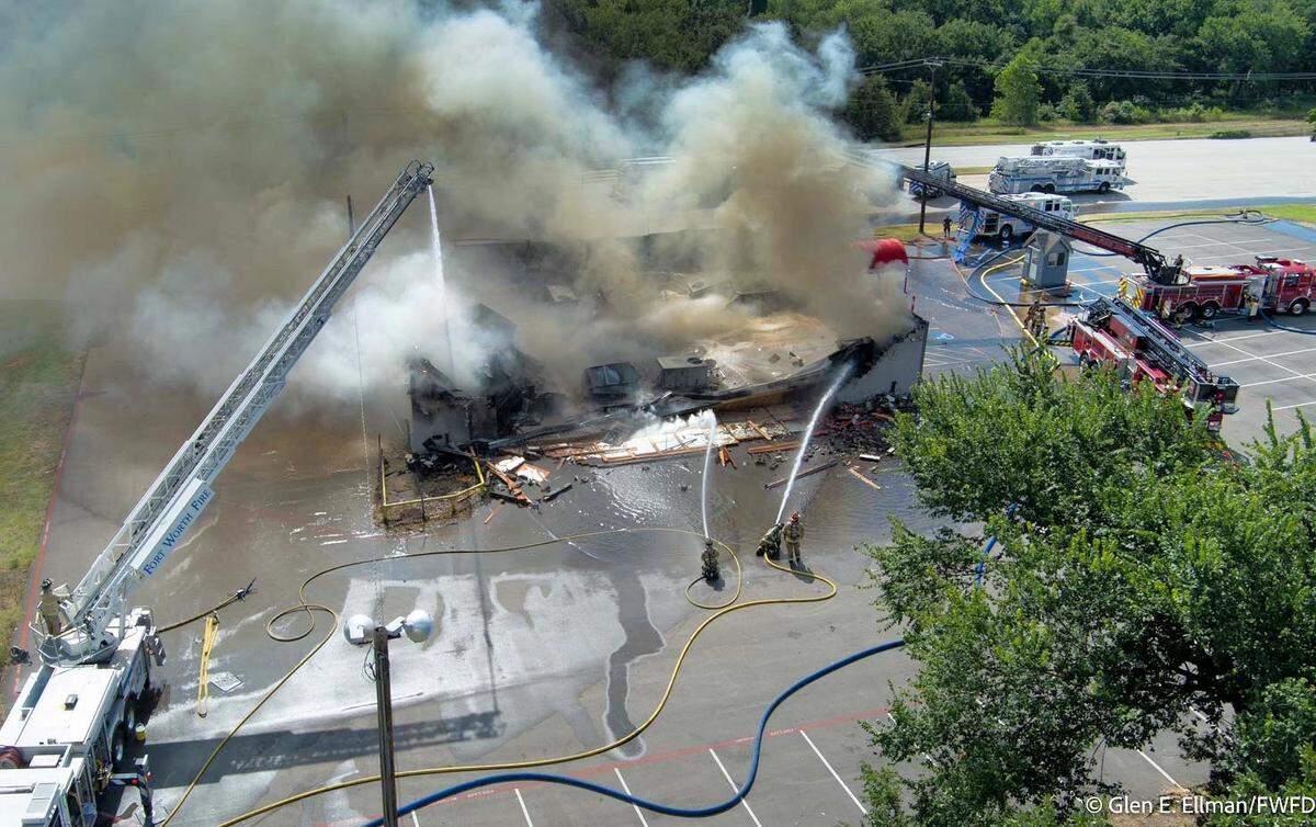Fort Worth firefighters battled a blaze at Baby Dolls, a strip bar located in far east Fort Worth, on Wednesday. Smoke was billowing from the building when they arrived, officials say, and parts of the building collapsed a few minutes later.