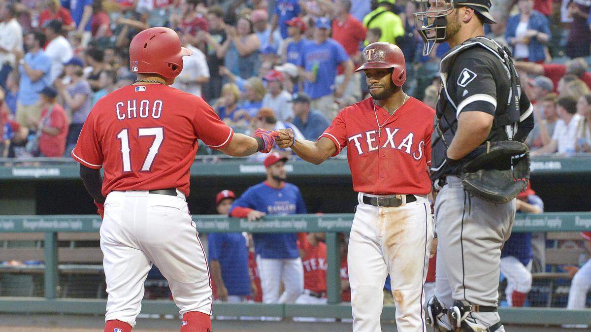 Texas Rangers designated hitter Shin-Soo Choo (17) is congratulated by center fielder Delino DeShields (3) on his 2 run home run during the third inning as the Rangers play the White Sox at Globe Life Park in Arlington, TX, Friday, June 29, 2018.