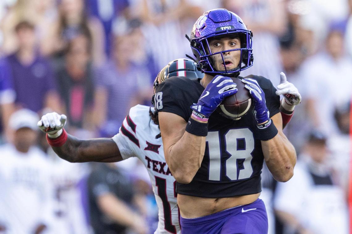 TCU wide receiver Jack Bech (18) catches a long pass from quarterback Josh Hoover (10) while guarded by Texas Tech defensive back Macho Stevenson (12) in the second half of an NCAA football game between TCU and Texas Tech at Amon G. Carter Stadium in Fort Worth on Saturday, Oct. 26, 2024. TCU won 35-34.