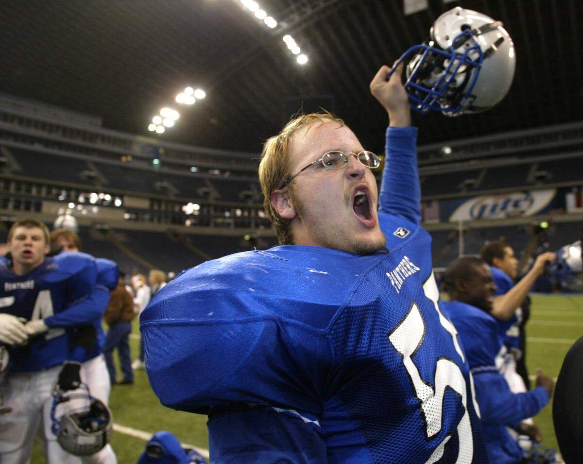 North Crowley’s Rubin Beckner (#55) celebrates his team’s playoff victory over Texas High School at Texas Stadium. North Crowley advances to the State 4A championship game. Photo taken on Friday, December 5, 2003 (FWST/Kelley Chinn)