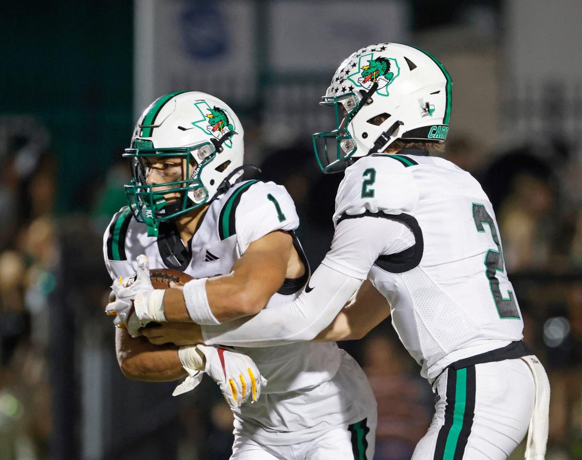 Southlake running back Riley Wormley (1) takes the handoff from quarterback Angelo Renda (2) during a UIL 6A Conference football game at Pennington Field in Bedford Texas, Friday, Sept. 20, 2024.