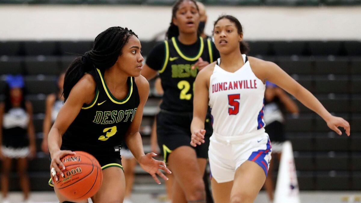DeSoto guard Kayla Glover (3) drives down court ahead of Duncanville guard Kiyara Howard-Garza (5) during the second half of the 6A Region II Regional Final basketball game at Waxahachie High School in Waxahachie, Texas, Tuesday, March 02, 2021. DeSoto defeated Duncanville . 52-39. (Special to the Star-Telegram Bob Booth)