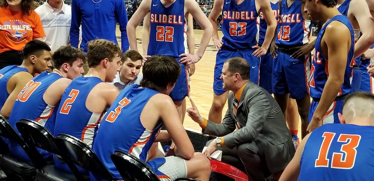 Slidell coach Casey Pierce in a huddle during a timeout of the 1A state semifinals, Thursday March 12, 2020.