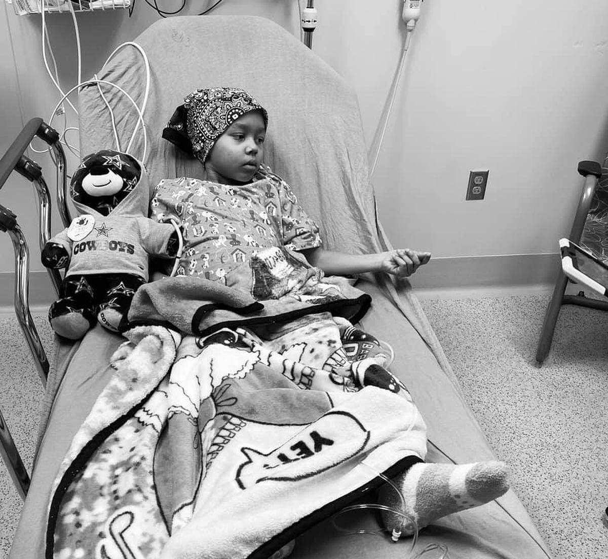 Adriana Nixon, 6, lies exhausted in a hospital bed. She has had to undergo chemotherapy treatments and take other medications as doctors have tried to control her cancer so she could qualify for a new liver.