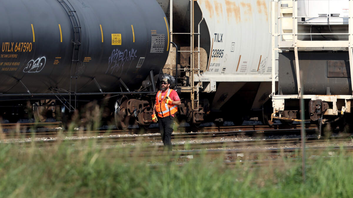 A worker monitors trains at the BSNF Railway Company’s North Yard in Fort Worth. Now that workers have seen the deal reached last week, many plan to vote no.