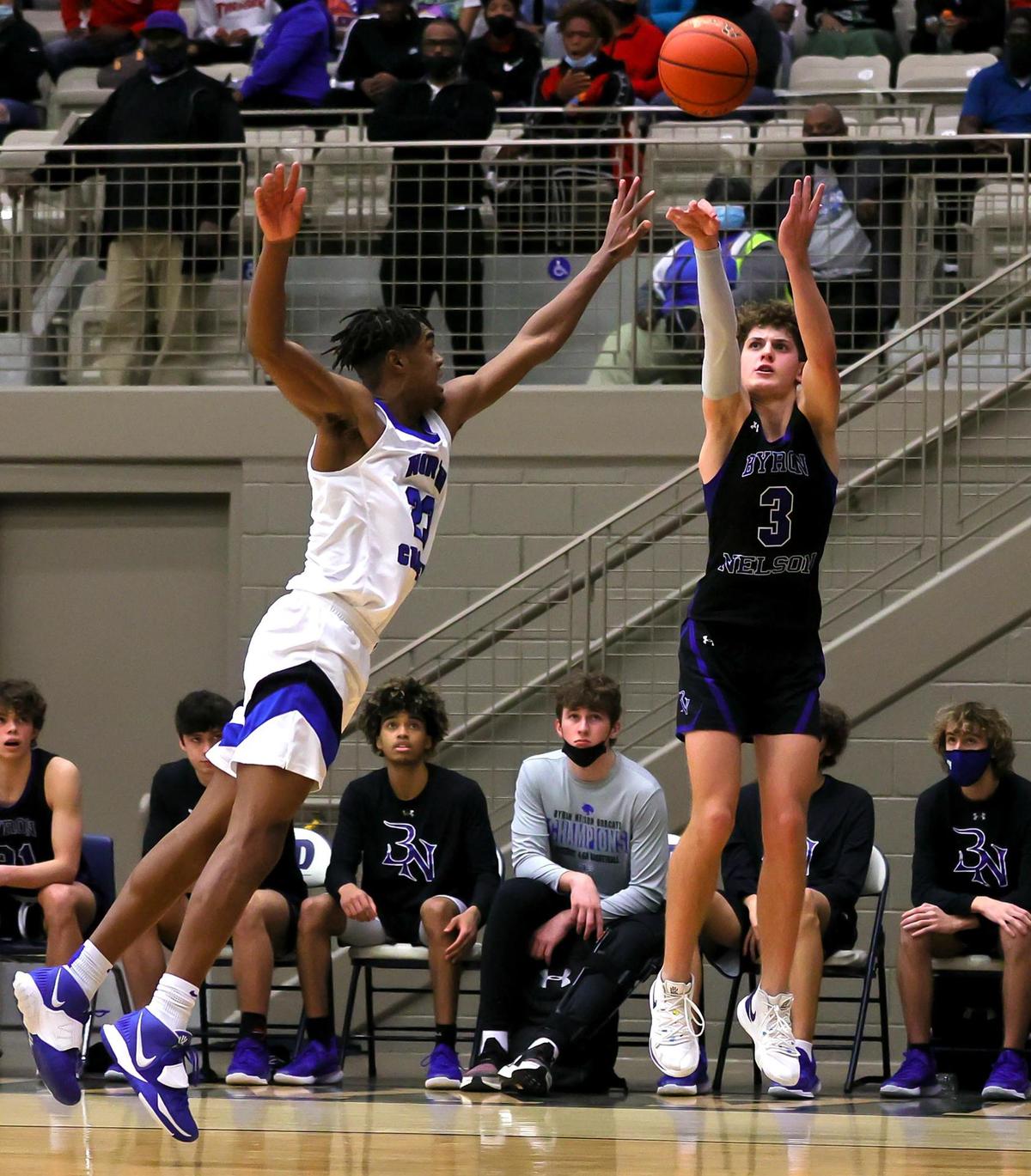 Byron Nelson guard Finley Bizjack (3) attempts a three point shot against North Crowley forward KD Davis (23) during overtime, Friday, February 26, 2021 of a 6A Region 1 Quarterfinal High School playoff Basketball game played at the Thomas Coliseum in Haltom City, Tx. (Steve Nurenberg Special to the Star-Telegram)