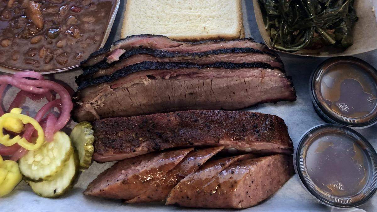 Brisket, a rib and sausage at Smoke-A-Holics BBQ in Fort Worth